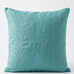 Chikankari Blue throw pillow with vertical embroidered patterns and three central floral motifs, shown against a plain white background.